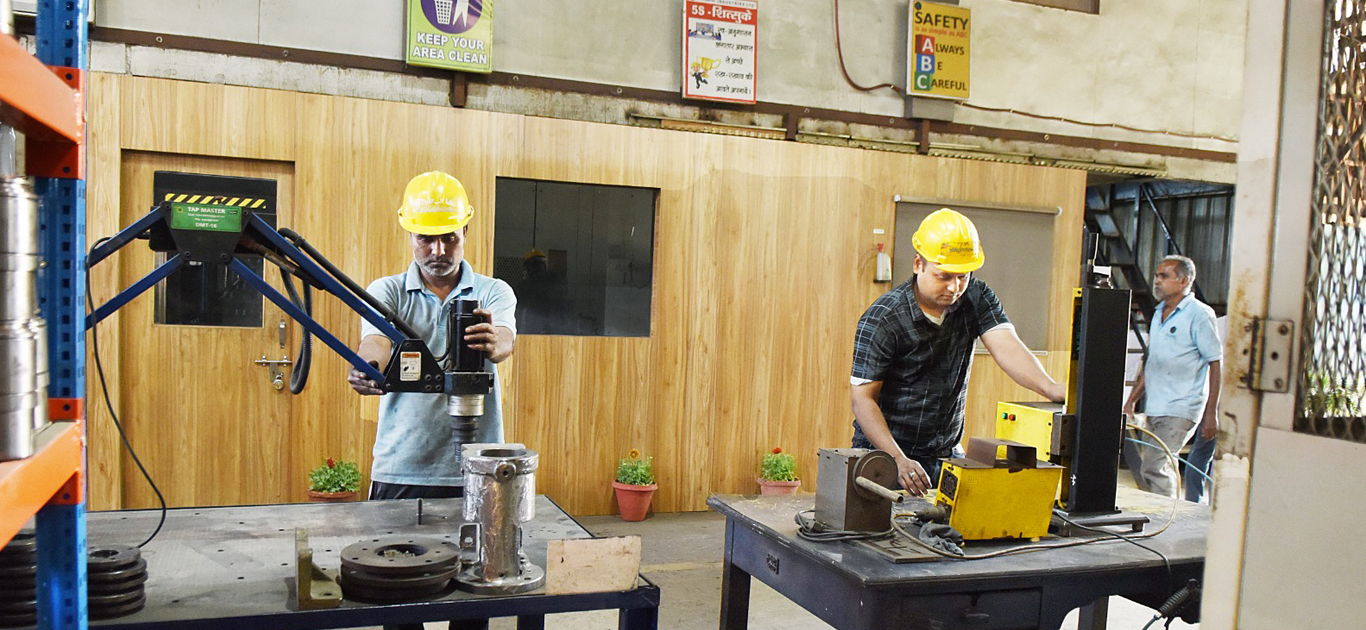 Tap Master machine for precise threading operations.